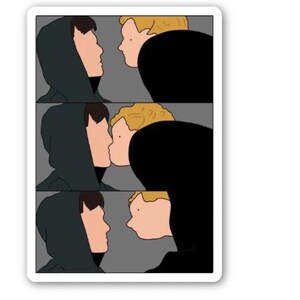 May include: A sticker with a three-panel cartoon illustration. Each panel depicts two figures in profile, one in a dark green hooded top and the other with blonde hair, seemingly kissing. The background is grey.