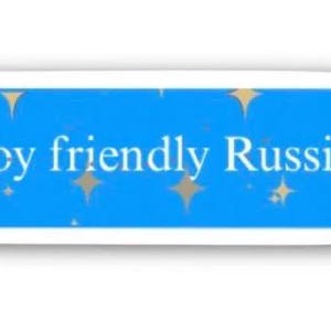 May include: A blue sticker in the shape of a speech bubble with the text "Enjoy friendly Russia" in white. The sticker has gold star accents.