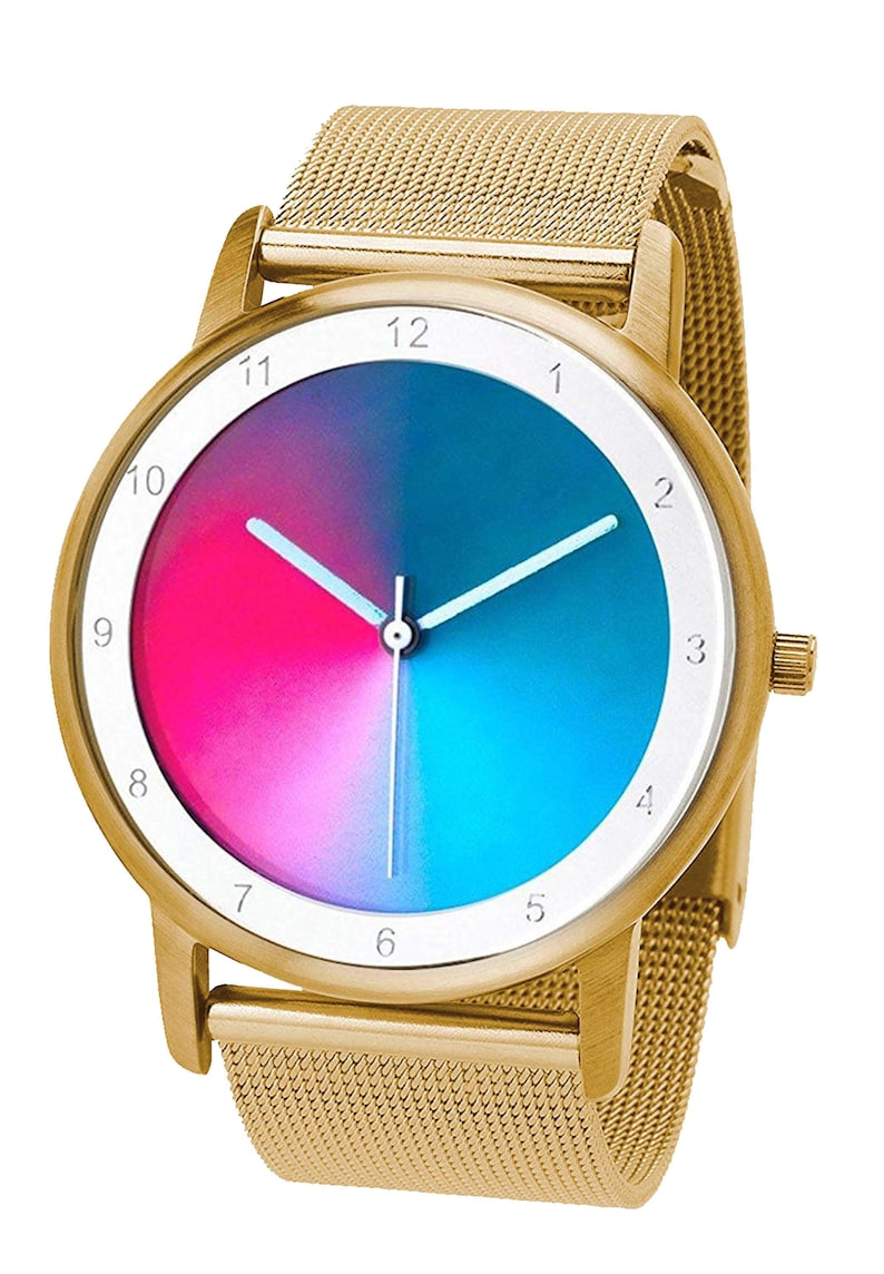 May include: Gold-tone wristwatch with a mesh band. The watch face features a gradient of pink and blue, with white hands and hour markers. The watch has a gold-tone bezel and a textured mesh band.