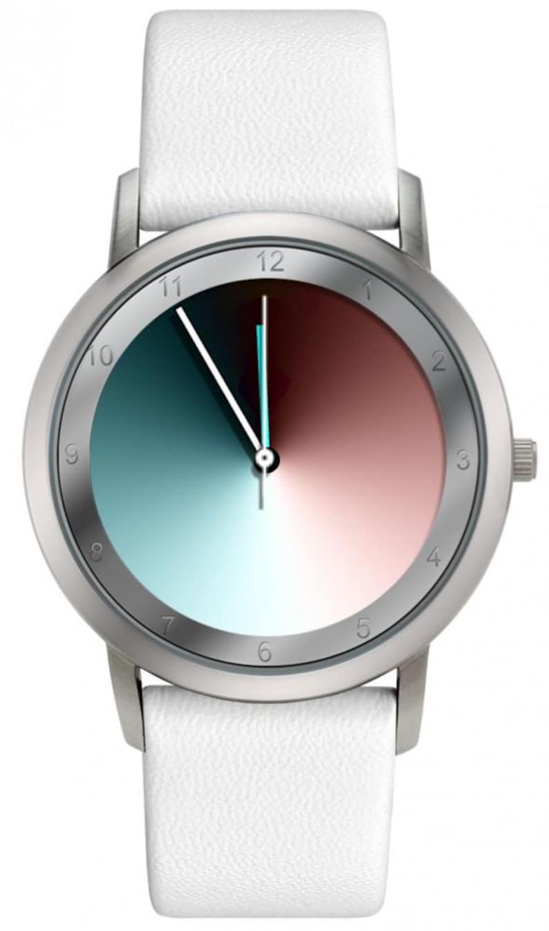 May include: A silver wristwatch with a white leather band. The watch face is divided into two color gradients: teal to blue and red to pink. The watch has silver hands and hour markers.