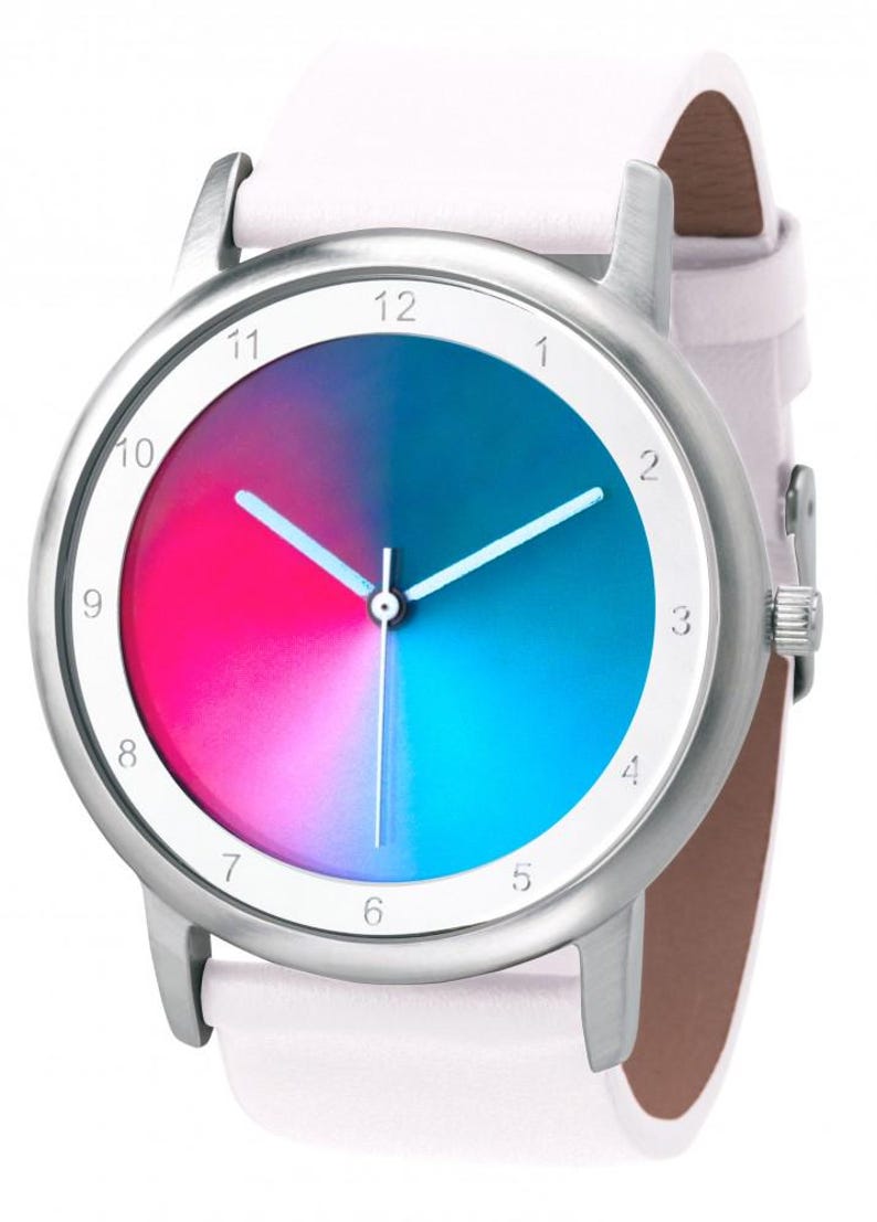 May include: A silver wristwatch with a white leather band. The watch face is divided into pink and blue sections, with white hands and numerals. The watch has a classic, minimalist design.