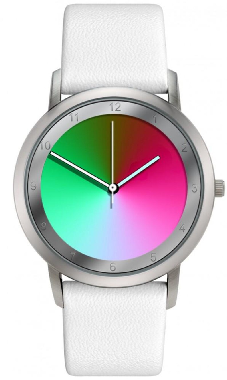 May include: A silver wristwatch with a white leather band. The watch face features a gradient of green, pink, and brown. The watch has silver hands and hour markers. The watch is a stylish accessory.