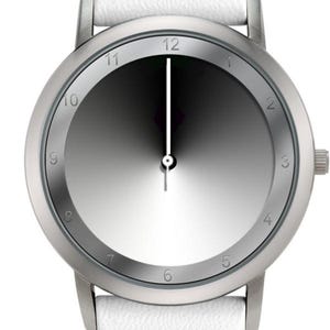 May include: A minimalist wristwatch with a silver-toned case and a gradient gray dial. The watch features a white leather strap. The hands are black and white. The watch face displays the numbers 1 through 12.