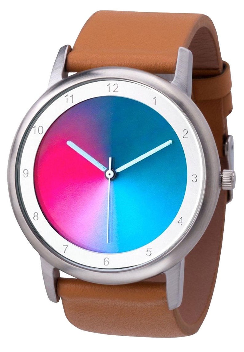 May include: A wristwatch with a silver-colored case and a brown leather band. The watch face is divided into two halves, one pink and one blue, with white hands and hour markers. The watch is a stylish accessory.