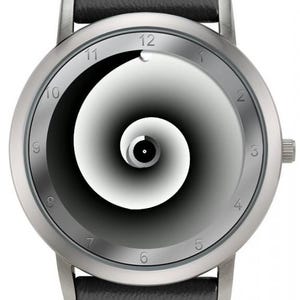 May include: A silver wristwatch with a black leather band. The watch face features a black and white spiral design with silver numerals marking the hours. The watch has a minimalist, modern aesthetic.