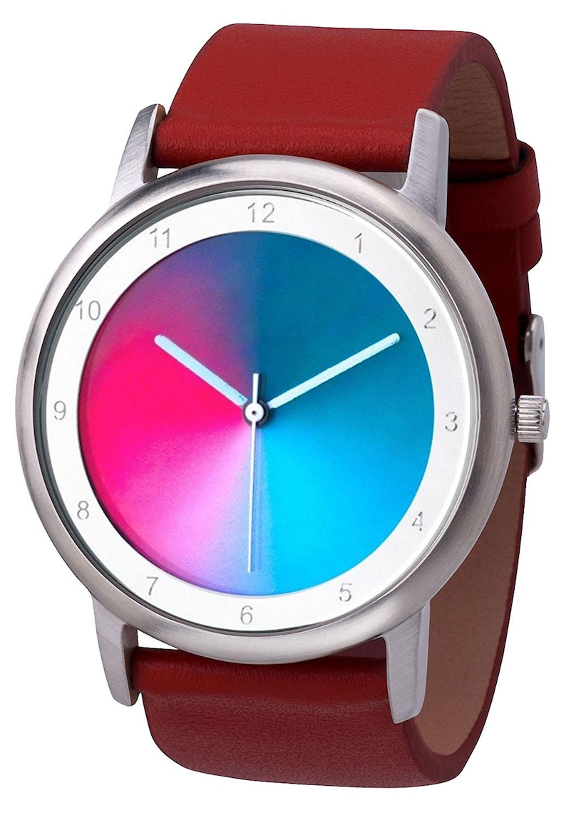 May include: A wristwatch with a silver case and a red leather band. The watch face is divided into pink and blue sections, with white hands and hour markers. The watch band is approximately 0.75 inches wide.
