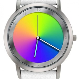 May include: A wristwatch with a silver-colored case and a white leather strap. The watch face displays a vibrant rainbow gradient with black numerals and hands. The watch has a classic, minimalist design.