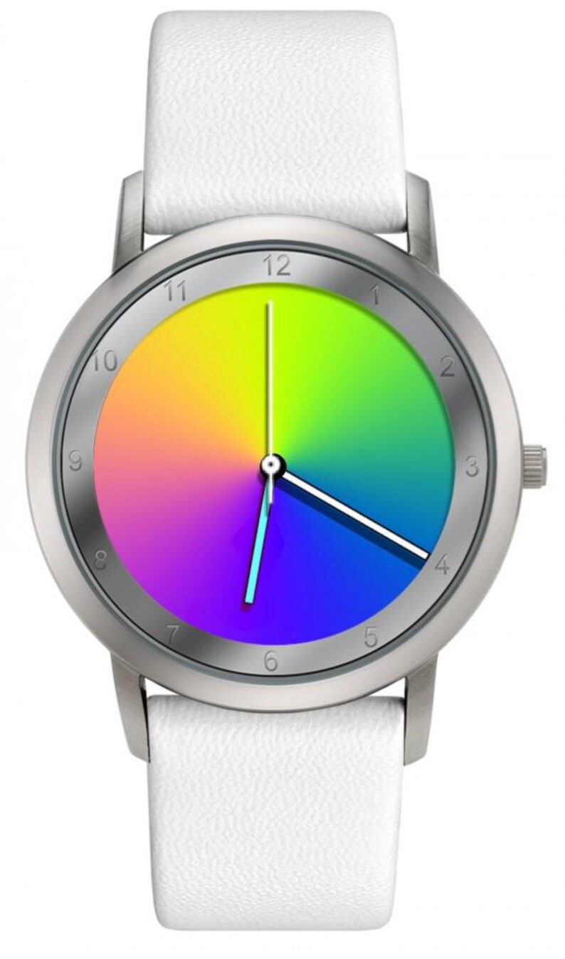 May include: A wristwatch with a silver-colored case and a white leather strap. The watch face displays a vibrant rainbow gradient with black numerals and hands. The watch has a classic, minimalist design.