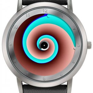 May include: Silver wristwatch with a black leather band. The watch face features a spiral design in shades of brown, teal, and blue. The watch has silver hands and hour markers. The watch band is 22mm wide.