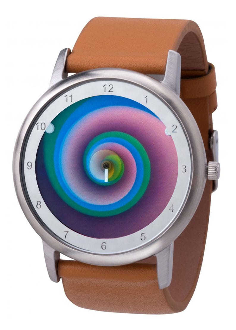 May include: A wristwatch with a stainless steel case and a brown leather band. The watch face features a colorful spiral design in shades of blue, green, and pink. The watch has white numerals and hands.