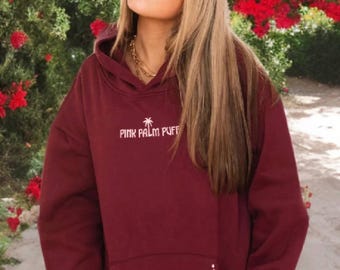 Rosa Palm Puff-huvtröja med ”Lev i nuet”-motiv