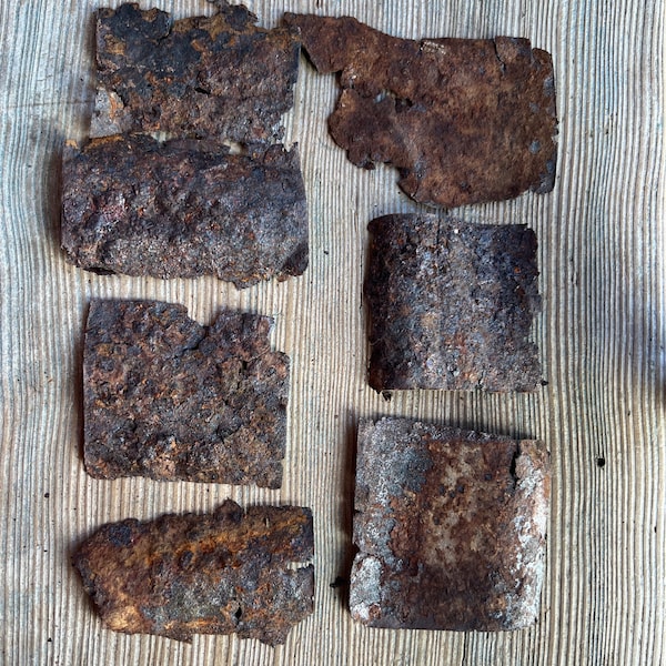 Seven rusty metal pieces,  corrugated metal,  thick rusty crusty metal old metal roofing