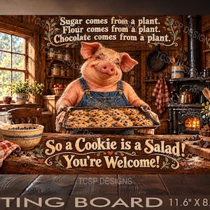 May include: A rectangular cutting board featuring a pig in blue overalls holding a tray of chocolate chip cookies. Text reads: Sugar comes from a plant. Flour comes from a plant. Chocolate comes from a plant. So a Cookie is a Salad! You're Welcome!