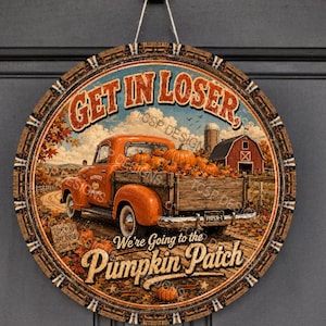 May include: A round hanging sign featuring an orange vintage pickup truck filled with pumpkins on a dirt road. The text reads GET IN LOSER and We're Going to the Pumpkin Patch. The background shows a red barn, autumn trees, and a blue sky.