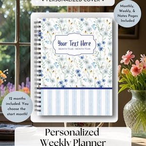 May include: A spiral-bound planner with a white cover featuring a blue and yellow wildflower pattern and a bottom section with light blue vertical stripes. The centre has a rectangular label with the text Your Text Here and Month Year - Month Year.