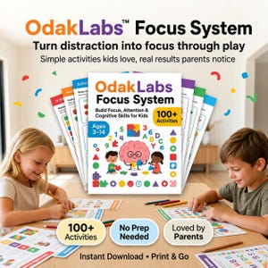 May include: The OdakLabs Focus System is a collection of educational activity sheets for children ages 3-14. The cover features a pink brain character, numbers, letters, and shapes. It includes 100+ activities designed to build focus and attention.
