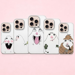 May include: A collection of white phone cases with unique cartoon illustrations. Each case features a different character with expressive faces, including one with a detective hat and pipe. The designs are outlined in black and have pink and white accents.