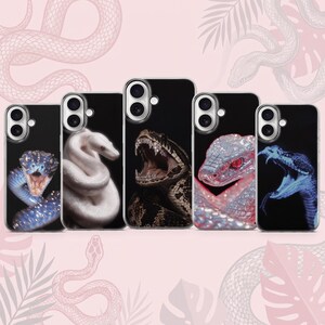 May include: Five rectangular phone cases arranged in a row, each featuring a distinct snake graphic against a black background. The designs include a blue snake, a white snake, a brown patterned snake with an open mouth, a pink snake, and a blue snake.
