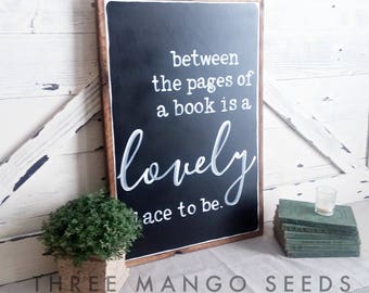 Between the pages of a book is a lovely place to be framed wood sign / 17 x 25 / Black / White / Sign