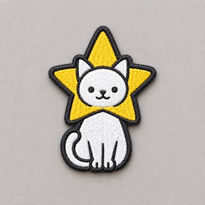 May include: An embroidered patch featuring a white cat sitting upright. The cat is framed by a bright yellow five-pointed star that acts as a collar or halo around its head. The entire design is outlined in thick black thread stitching.
