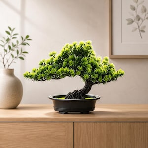 May include: A small artificial bonsai tree with vibrant green needle-like foliage and a dark, textured trunk. The tree is planted in a shallow, matte black oval container with a wide rim and a stable base, showcasing a detailed, realistic appearance.