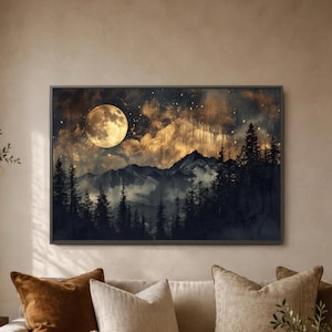 May include: A framed landscape art print depicting a nighttime mountain scene. The artwork features a large, glowing full moon, golden clouds, and silhouetted evergreen trees. The color palette includes shades of gold, black, and blue.