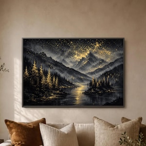 May include: A rectangular wall art print featuring a landscape of dark mountains and a forest of pine trees reflected in a calm lake. The scene is illuminated by a golden, starry night sky and glowing highlights on the trees and water surface.