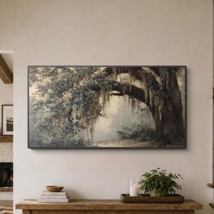 May include: A rectangular landscape painting featuring a large, dark tree with sweeping branches covered in hanging moss. The scene is rendered in muted, earthy tones of brown, gray, and soft green, depicting a misty, atmospheric forest path.