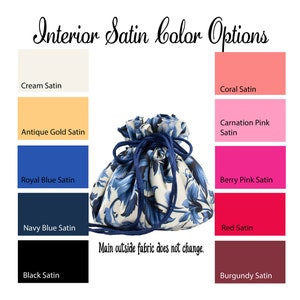 May include: A drawstring bag with a blue and white floral pattern. The bag is shown with different interior satin lining color options: cream, antique gold, royal blue, navy blue, black, coral, carnation pink, berry pink, red, and burgundy.