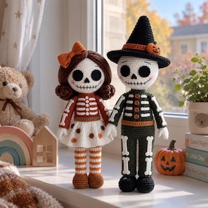 May include: Two handmade crochet dolls featuring skeleton designs. The left doll has brown hair, an orange bow, and a white skirt with orange and brown dots. The right doll wears a black witch hat with a small pumpkin and a dark green skeleton suit.