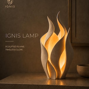 May include: A beige sculpted flame-shaped lamp emitting a warm internal glow. The text on the image reads: IGNIS, IGNIS LAMP, SCULPTED FLAME. TIMELESS GLOW. The lamp features curved, layered panels that mimic the appearance of flickering fire.