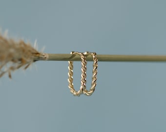 Twisted Oval Huggie Earrings in Solid 10k Yellow Gold.