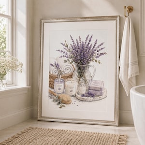 May include: A framed wall art print depicting a glass pitcher filled with purple lavender sprigs, a wicker basket with rolled white towels, a glass soap dispenser, a scented candle, a small glass bottle, and two bars of lavender soap.
