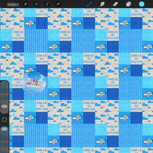 May include: A repeating pattern featuring blue squares with airplane illustrations and the text "THANK GOD FOR LITTLE BOYS." The design includes clouds and a variety of blue shades, creating a playful and thematic aesthetic.