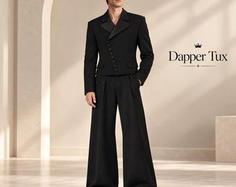 May include: A black tuxedo set featuring a cropped jacket with a diagonal button closure and wide-leg trousers. The jacket has satin lapels and long sleeves. The text Dapper Tux with a small crown icon is visible on the right side of the image.