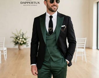 May include: A black blazer with dark green lapels, a dark green double-breasted vest, and matching dark green trousers. The outfit includes a white collared shirt, a black necktie with a gold tie bar, and a gold chain detail on the lapel.