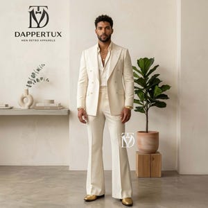 May include: Cream-colored double-breasted suit with flared pants. The suit is paired with a white shirt and gold-colored shoes. The image includes the text "DAPPERTUX MEN RETRO APPARELS".