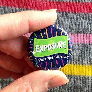 May include: A green and blue button with the text "Exposure Doesn't Pay the Bills" in white. The button has a black background with white stars and a green border.