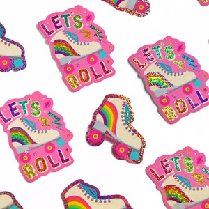 May include: Pink and white roller skate stickers with glitter and rainbow accents. The stickers say "Let's Roll" in a colorful font.