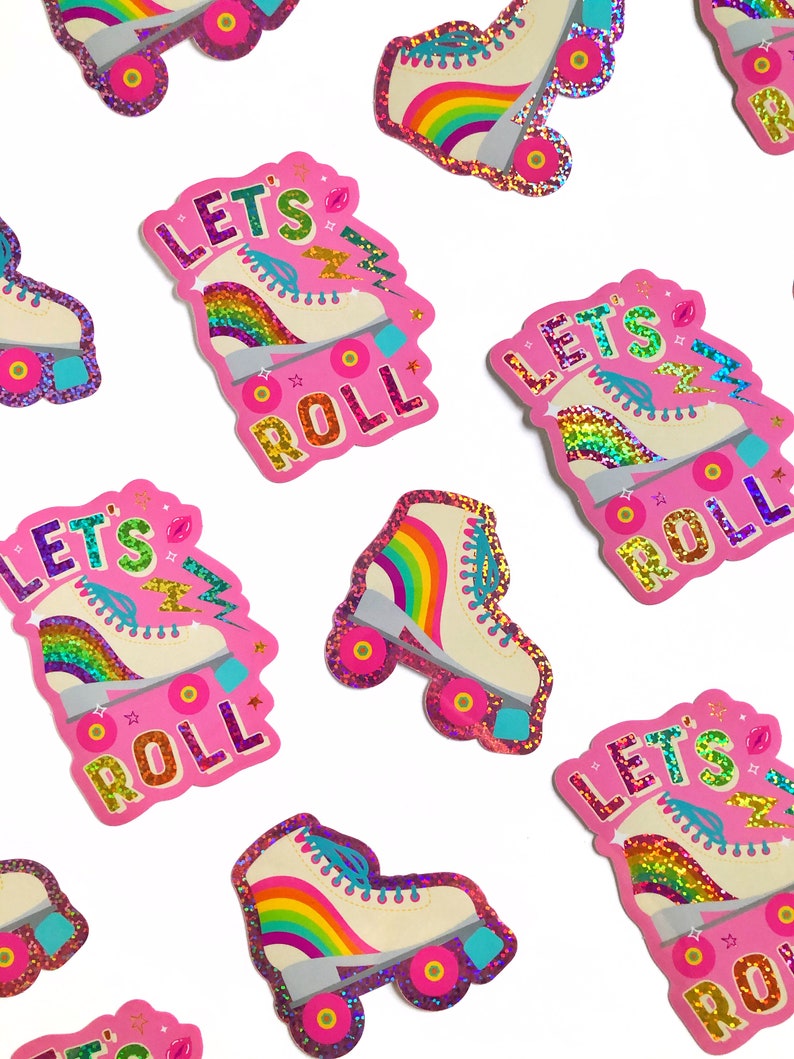 May include: Pink and white roller skate stickers with glitter and rainbow accents. The stickers say "Let's Roll" in a colorful font.