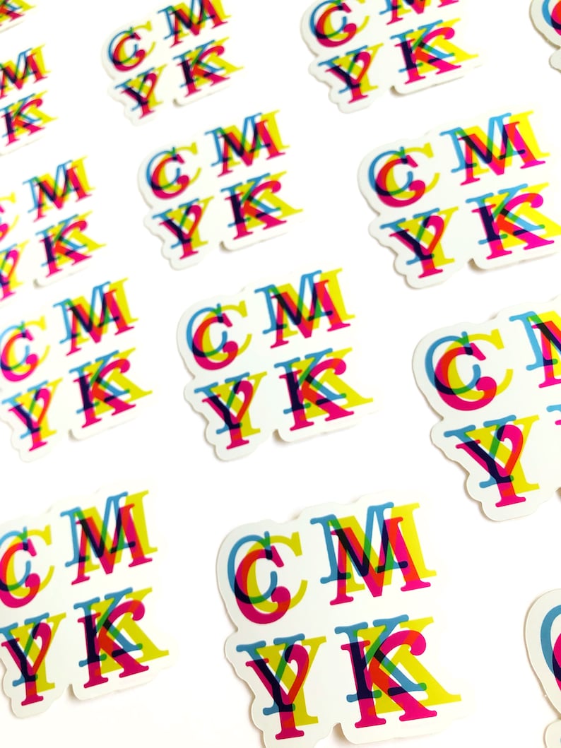 May include: A set of colorful stickers with the letters "CMYK" printed in a layered, overlapping design. The letters are printed in cyan, magenta, yellow, and black.