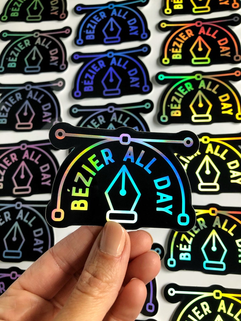 Puede incluir: Un primer plano de una pegatina hologr&aacute;fica con el texto "Bezier All Day" en un degradado arco&iacute;ris. La pegatina presenta un icono de plum&iacute;n estilizado.