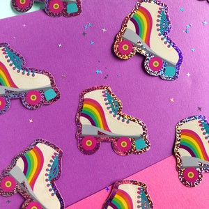 May include: A set of eight rainbow roller skate stickers. The stickers are made of glitter paper and have a white background with a rainbow stripe across the top. The stickers are perfect for adding a touch of fun to your laptop, water bottle, or planner.