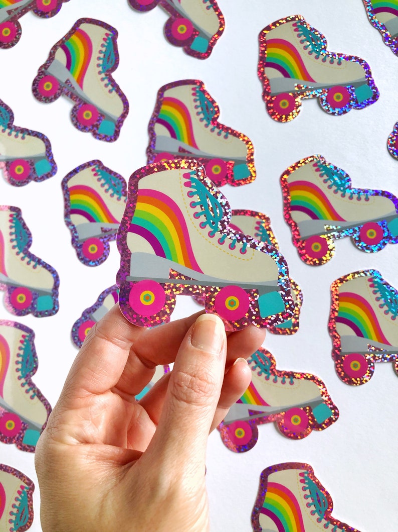 May include: A set of rainbow roller skate stickers with pink glitter. The stickers are perfect for decorating laptops, water bottles, and other surfaces.