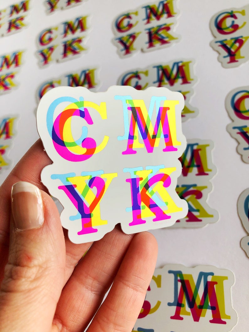 May include: A set of four colorful CMYK stickers with a white background. The letters are layered and overlapping, creating a 3D effect. The colors are cyan, magenta, yellow, and black.