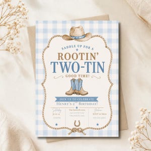 May include: A rectangular birthday invitation card featuring a light blue and white gingham background. The design includes a brown rope border, a cowboy hat, and a pair of blue cowboy boots. Text reads: SADDLE UP FOR A ROOTIN' TWO-TIN GOOD TIME! JOIN US TO CELEBRATE HENRY'S 2ND BIRTHDAY!
