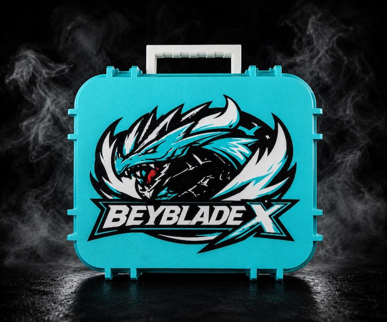 May include: A turquoise plastic carrying case with a white handle. The case features a graphic of a dragon with white and blue accents and the text "BEYBLADE X". The case has a rectangular shape with rounded corners.