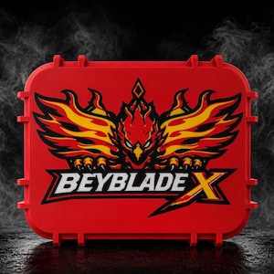 May include: A red rectangular case with a stylized phoenix design in yellow and orange. The text "BEYBLADE X" is displayed in white with a black outline. The case has a latching mechanism.