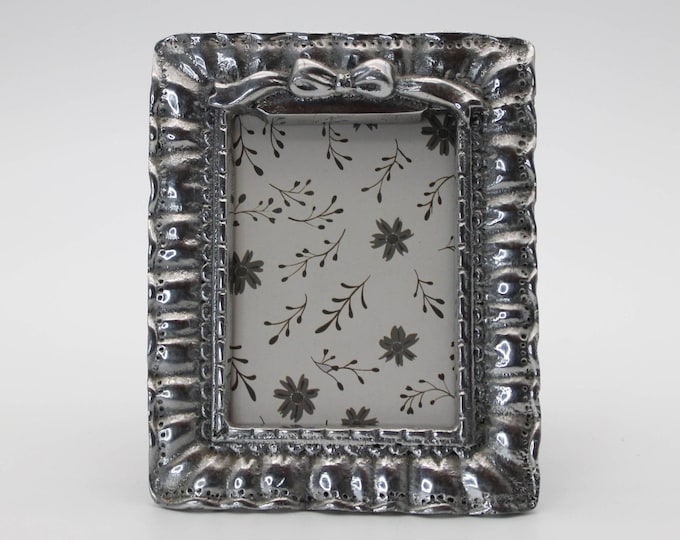 Vintage Handcrafted Mexican Pewter Bow Frame Ornate Ruffled Edge Wooden Back