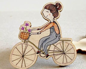 Wooden pin - girl on bike